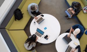 A view of students working on laptops from above